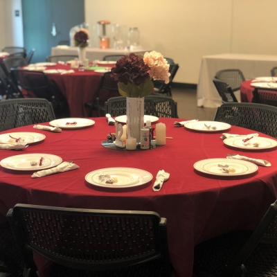 Thoughtful table settings are prepared for a wedding reception